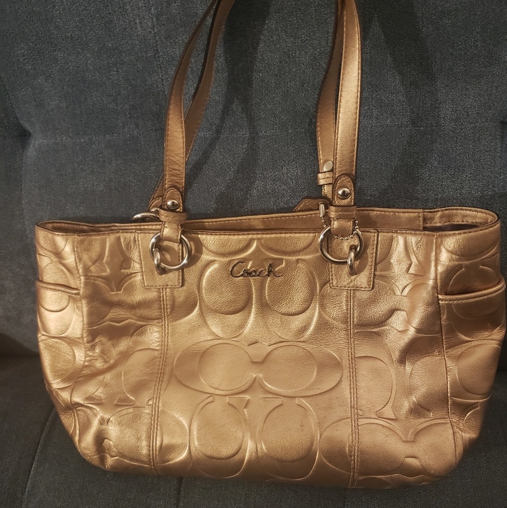 Like new gold Coach purse